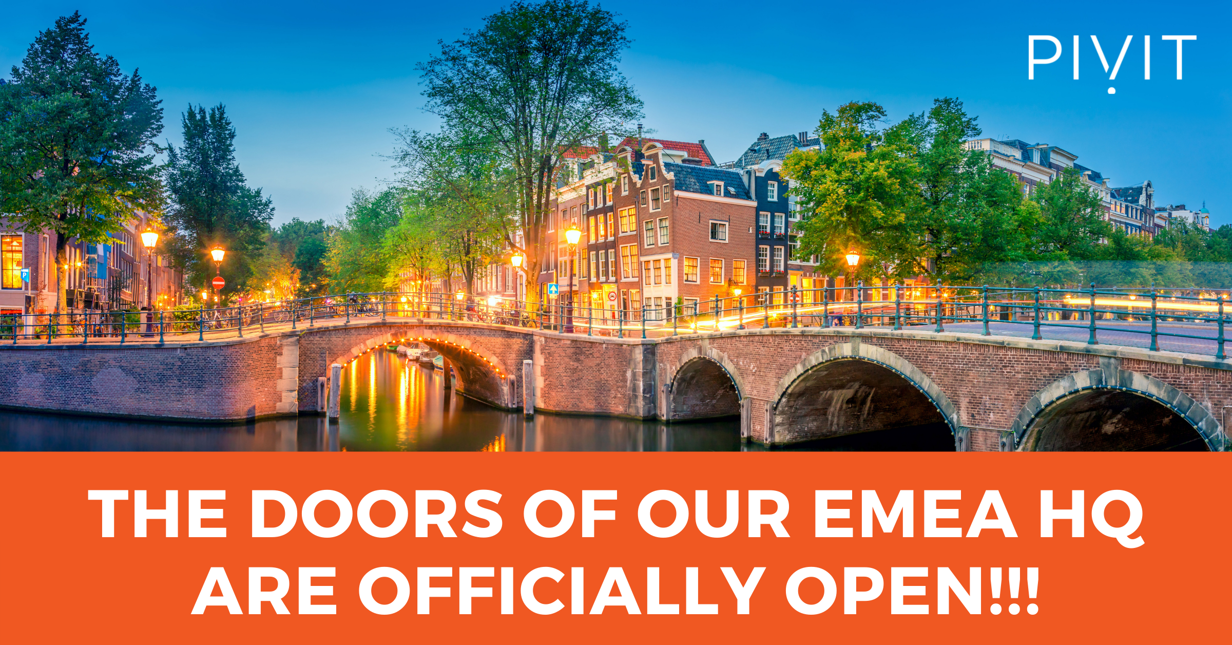 Amsterdam bridges at dusk with orange banner below announcing PivIT Global's EMEA HQ opening